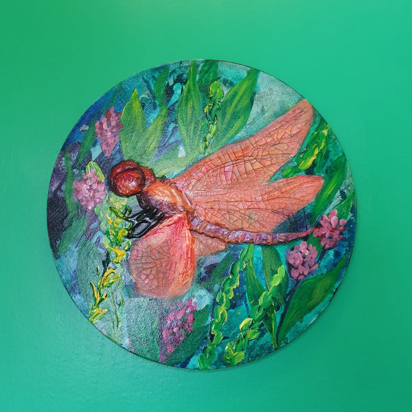 aferdita fazliu drozd art, orange dragonfly on green background of flowers and grasses. mixed media created with acrylic and crackle paste