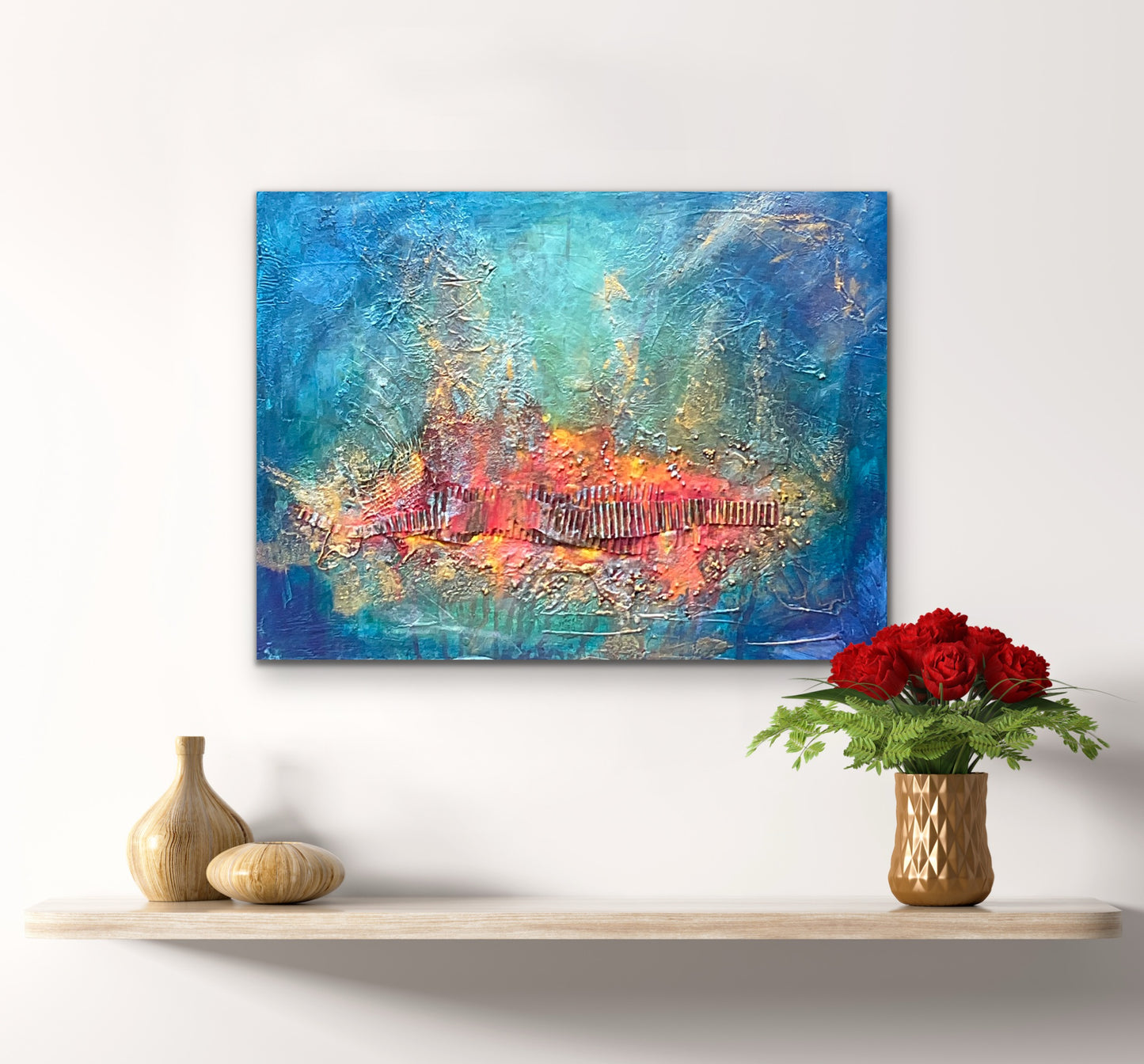 mixed media with a red / orange and gold textured focal point surrounded with a blue turquoise background.