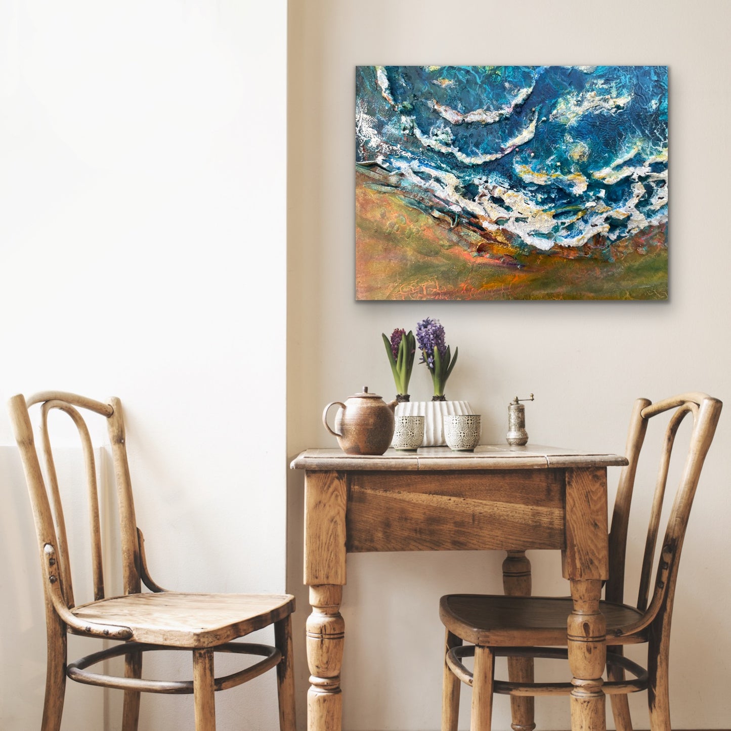 mixed media seascape with waves crashing into the beach