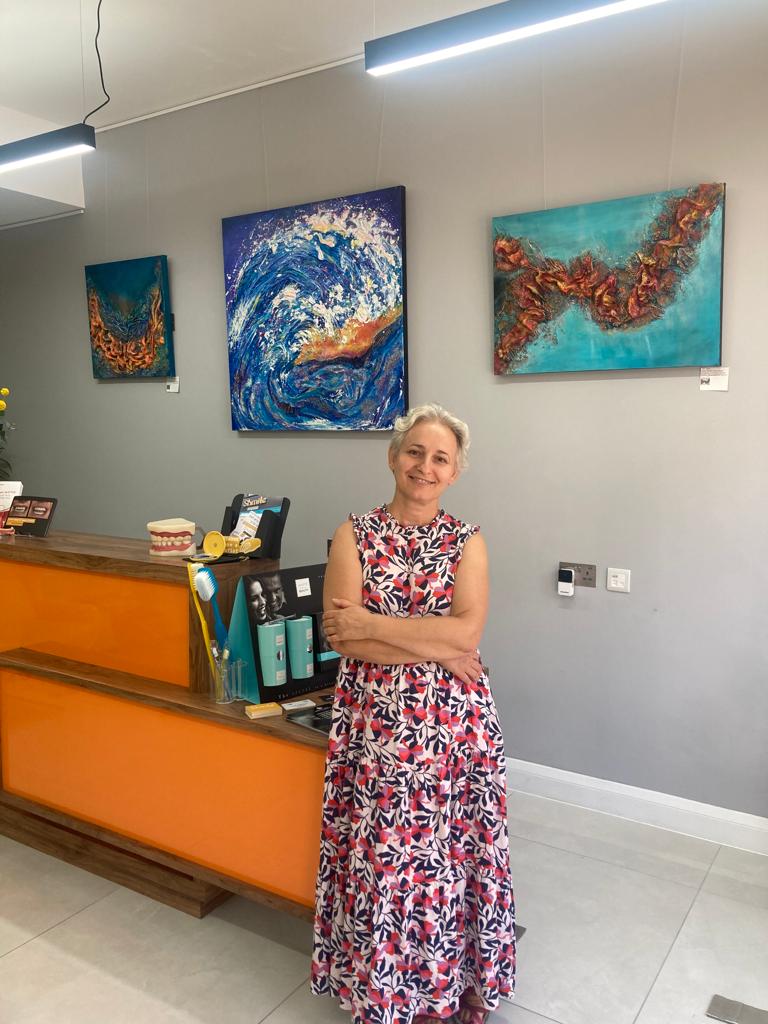 Aferdita Mixed media artist from Bromley  and her paintings Stoked, Adrift and Ray of Light at the Shmile Clinic Bromley 