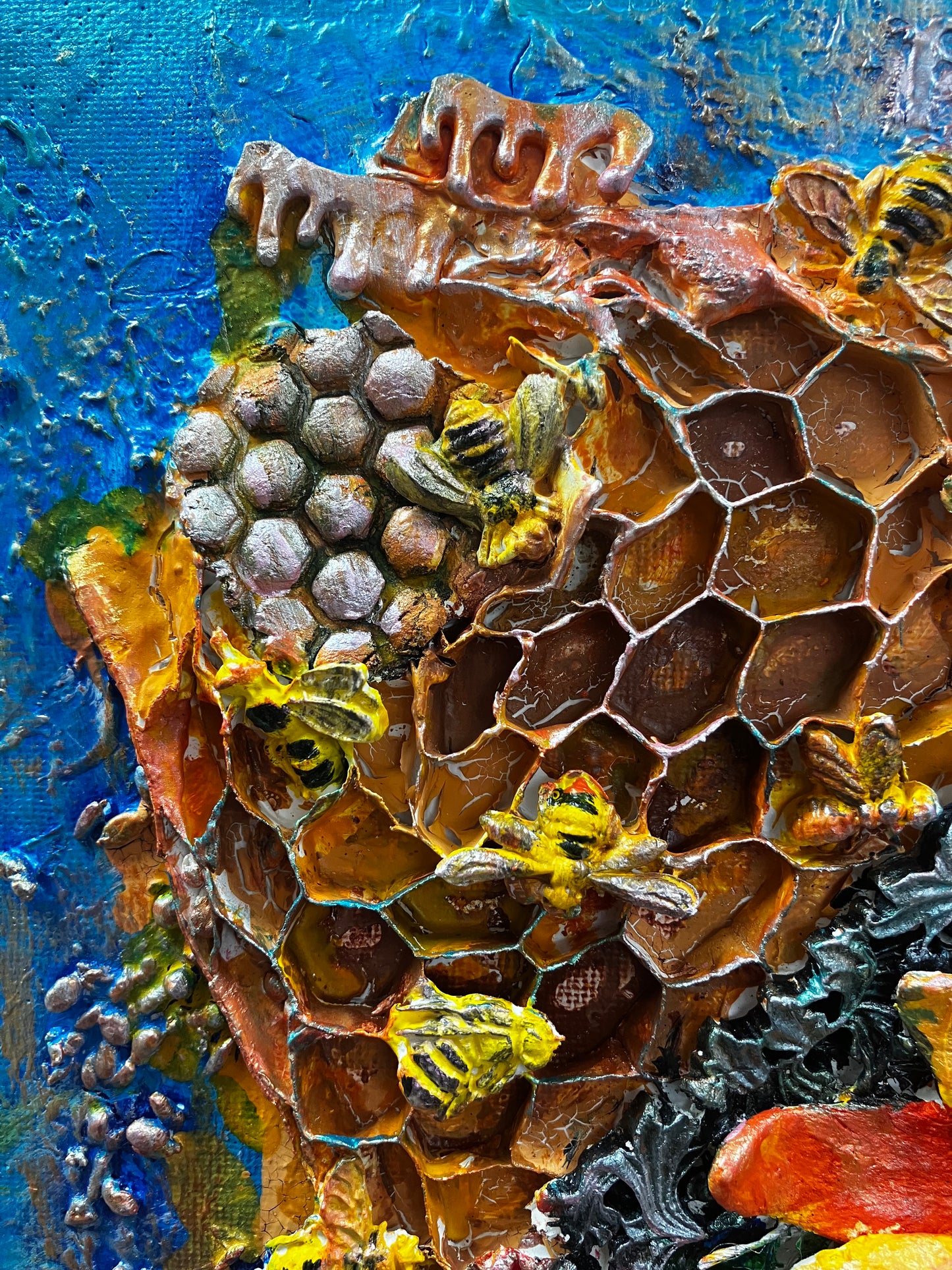 blue background, sunflowers and beehive raised above the canvas created with powrtex. powertex  clay bees placed at the top. lovely warm red, oranges and yellows 