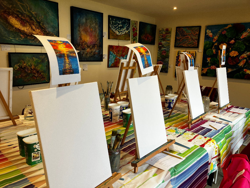 Art studio with easels, canvases, and art supplies