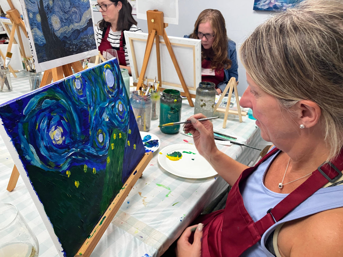 Art class with participants painting, inspired by Van Gogh's 'Starry Night'.